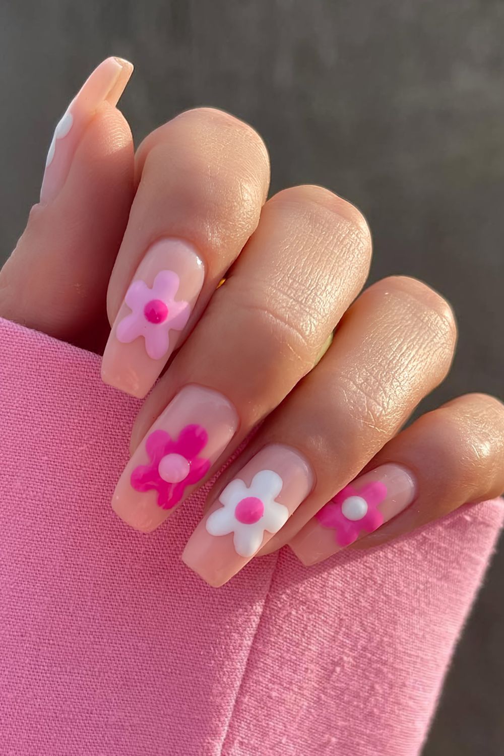 Neutral nails with pink and white chunky flowers