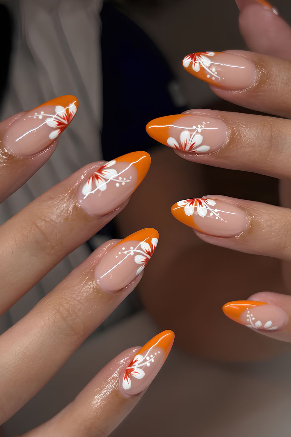 Orange French mani with hibiscus art