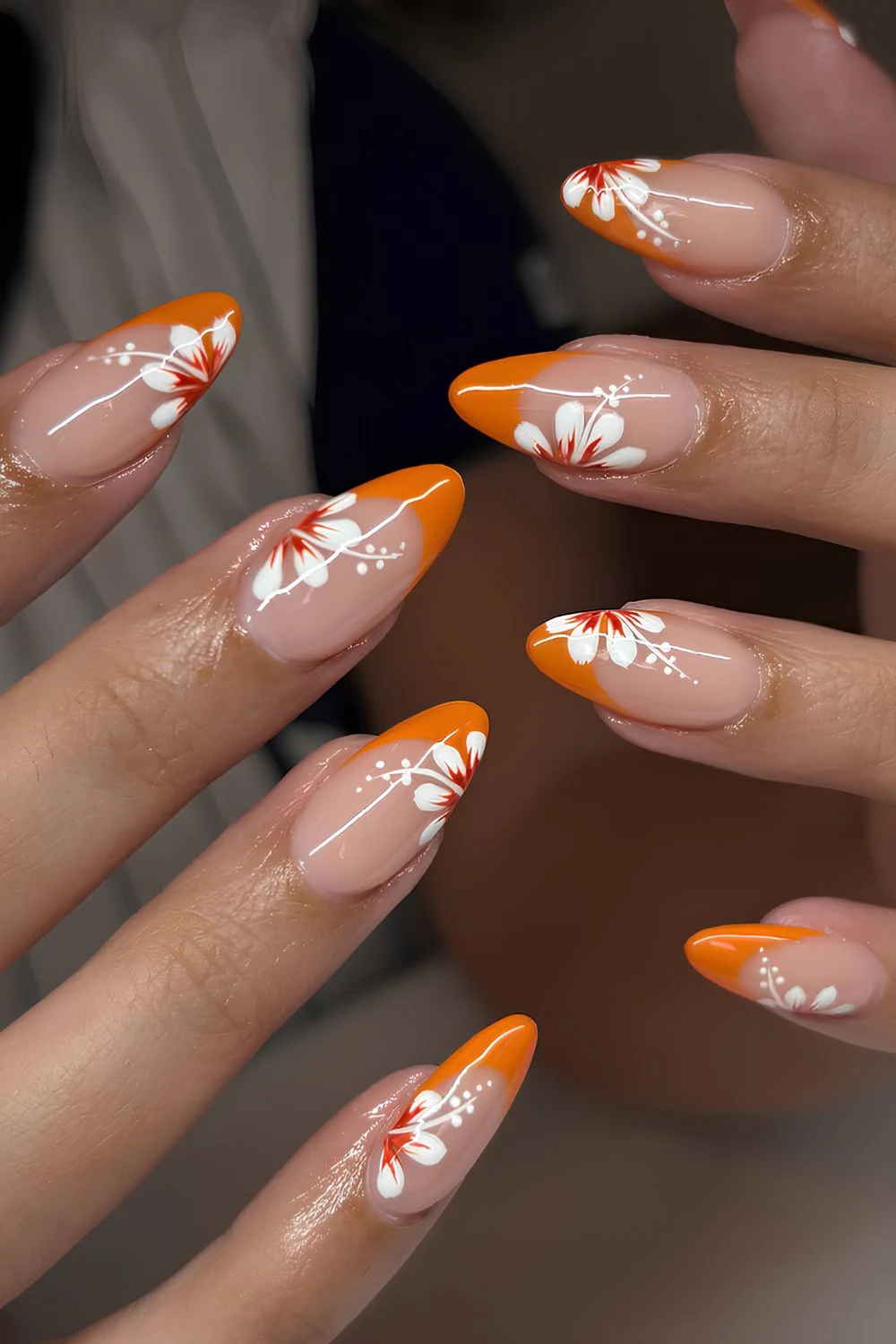 Orange French mani with hibiscus art