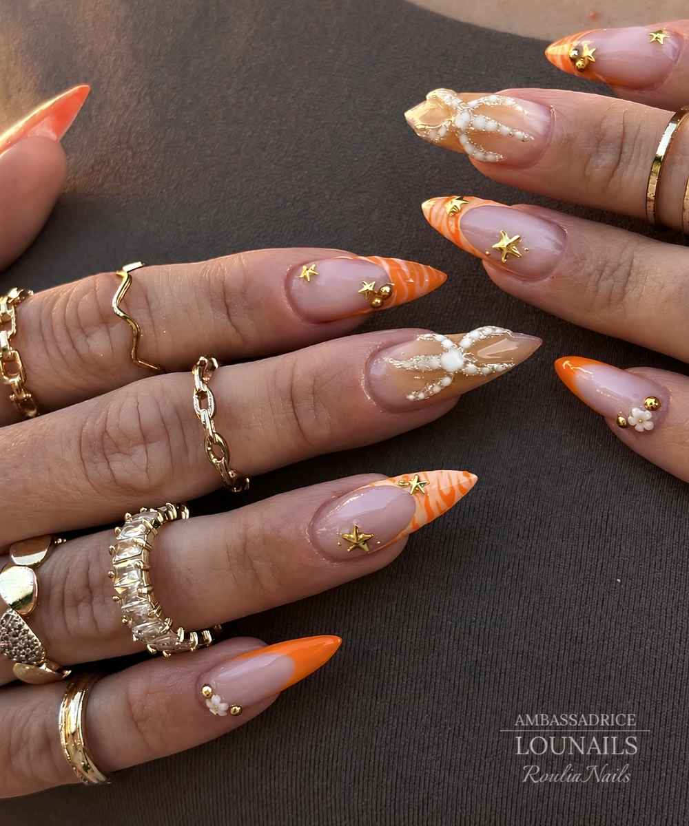 Orange nails with starfish art