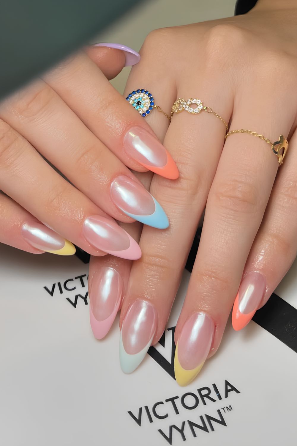 Pastel French tip nails with chrome finish