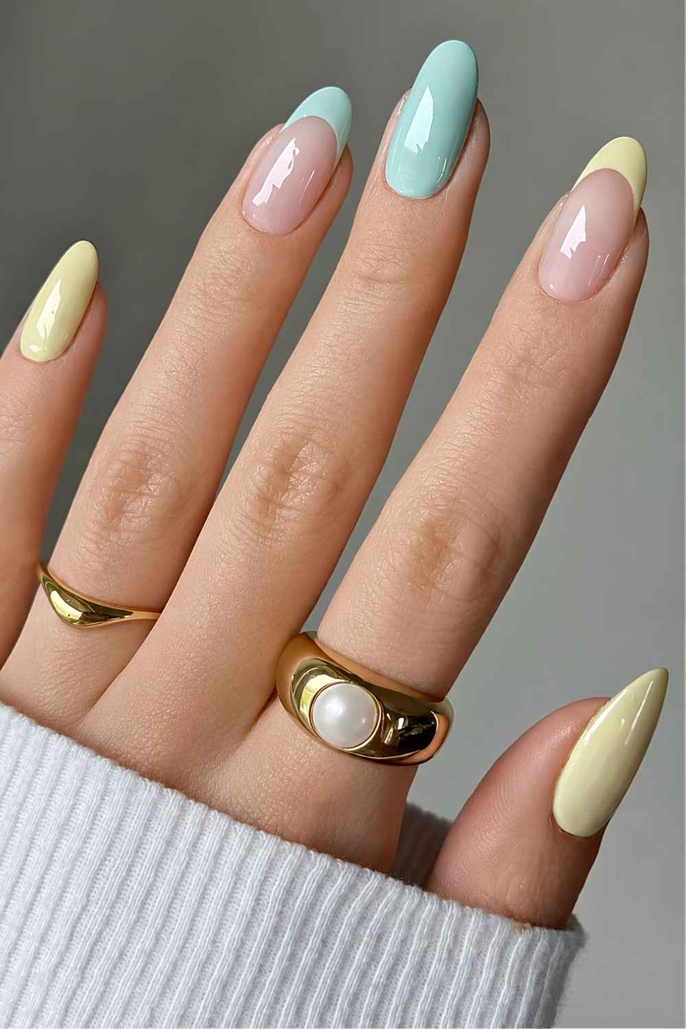 Pastel blue and butter yellow mani with accent French tips
