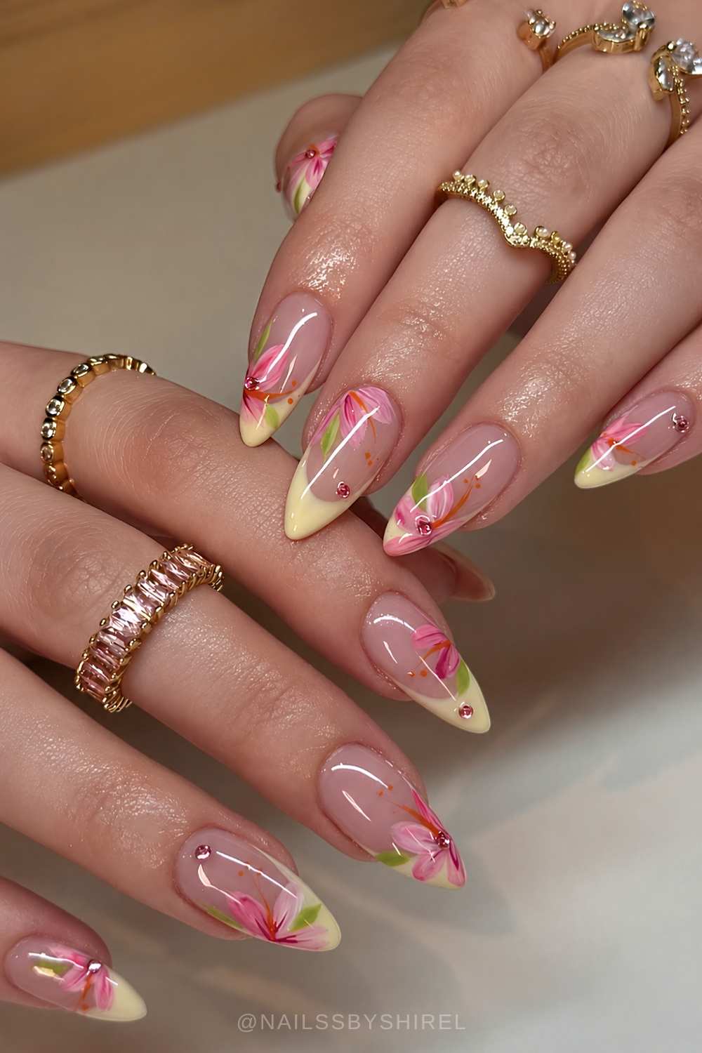 Pastel yellow French nails with pink flowers