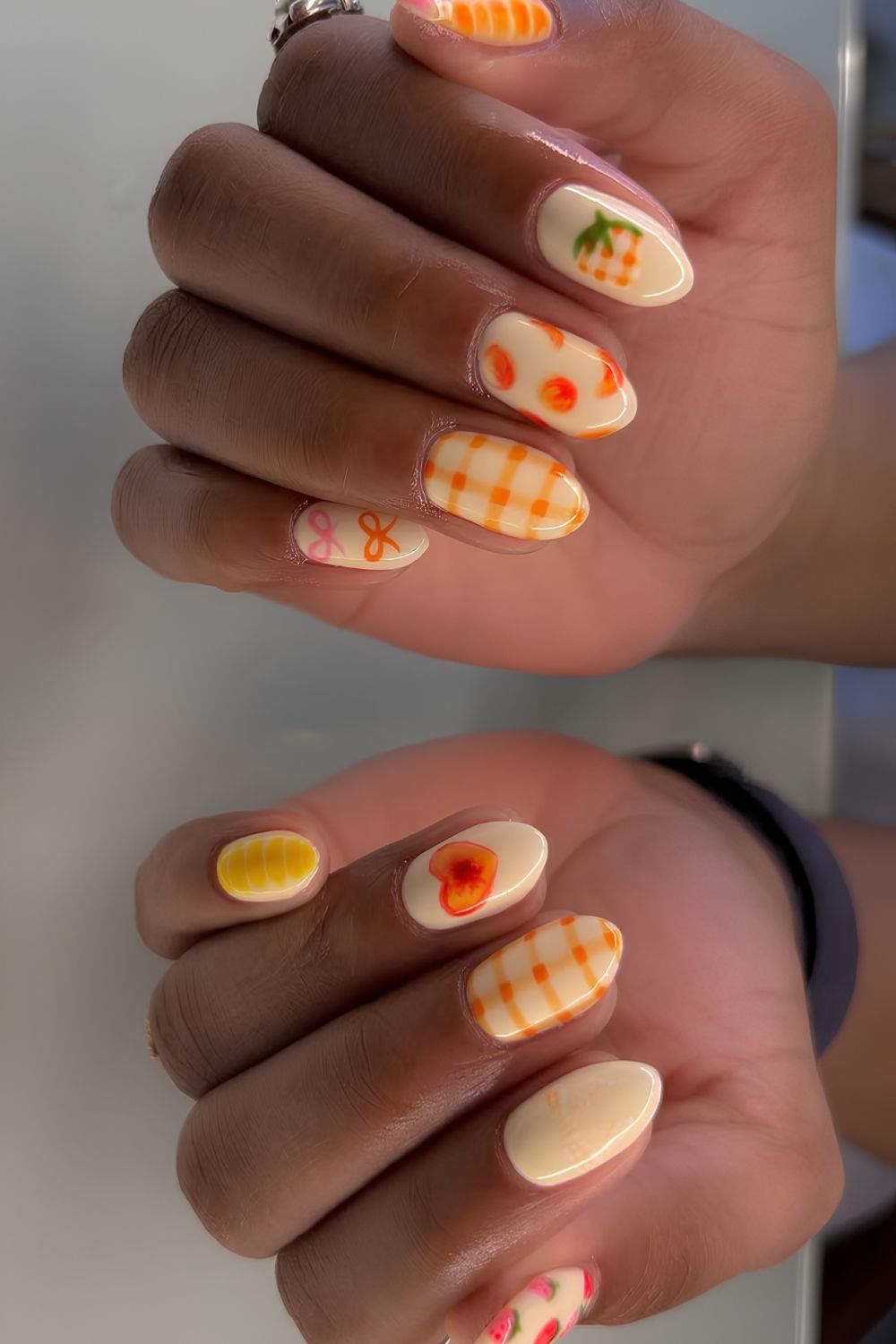 Peach picnic inspired nails with gingham and fruit art