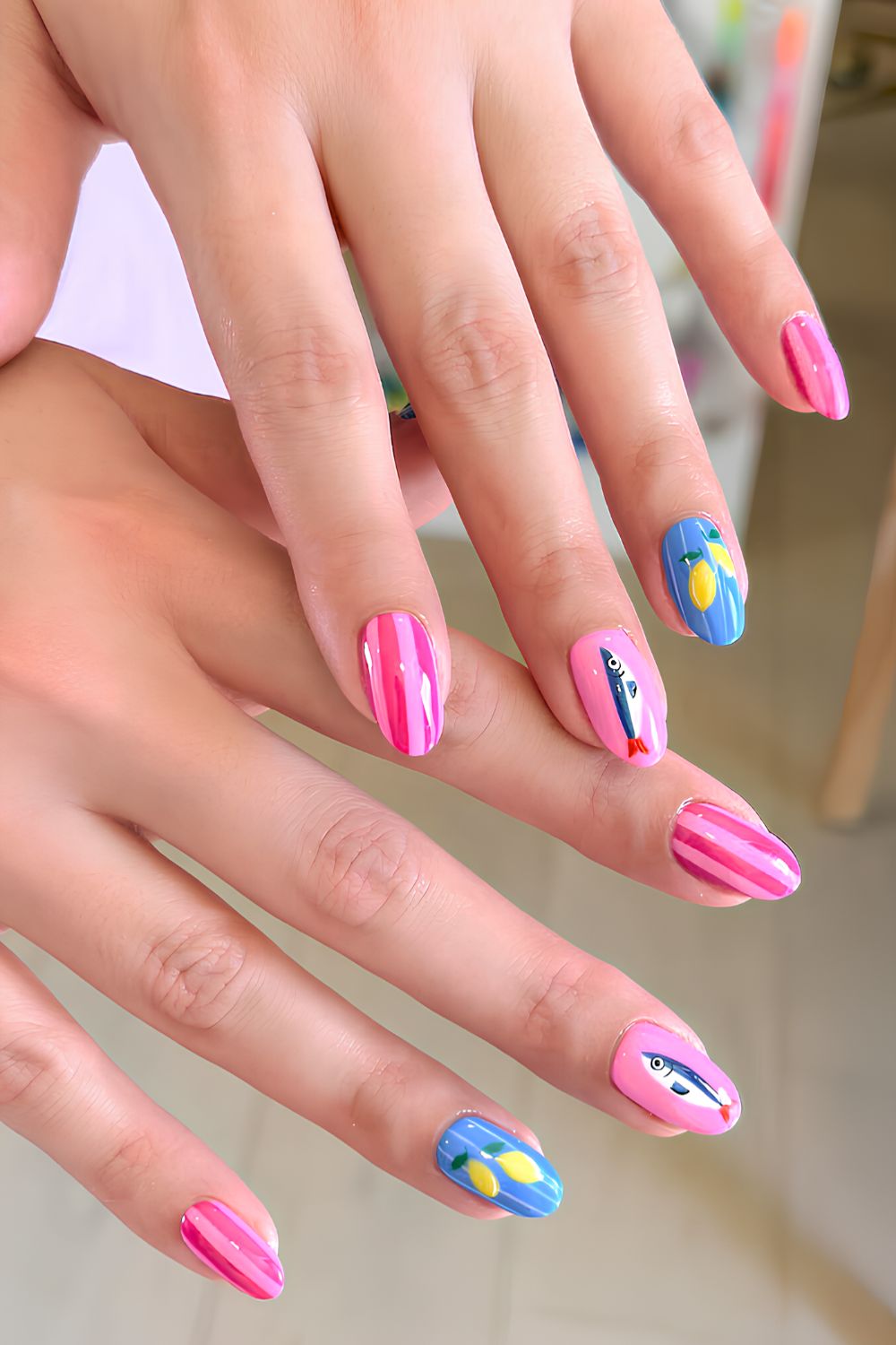 Pink and blue nails with stripes and lemons