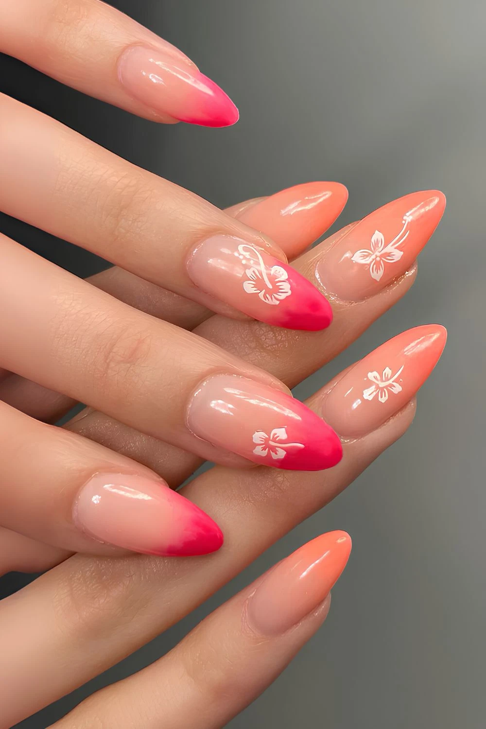 Pink and orange ombre nails with hibiscus art