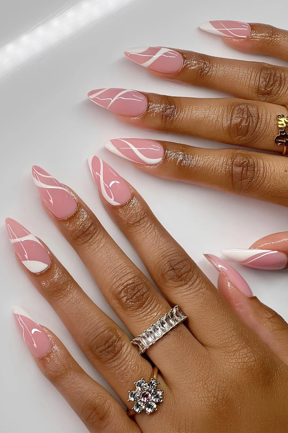 Pink and white swirly nails