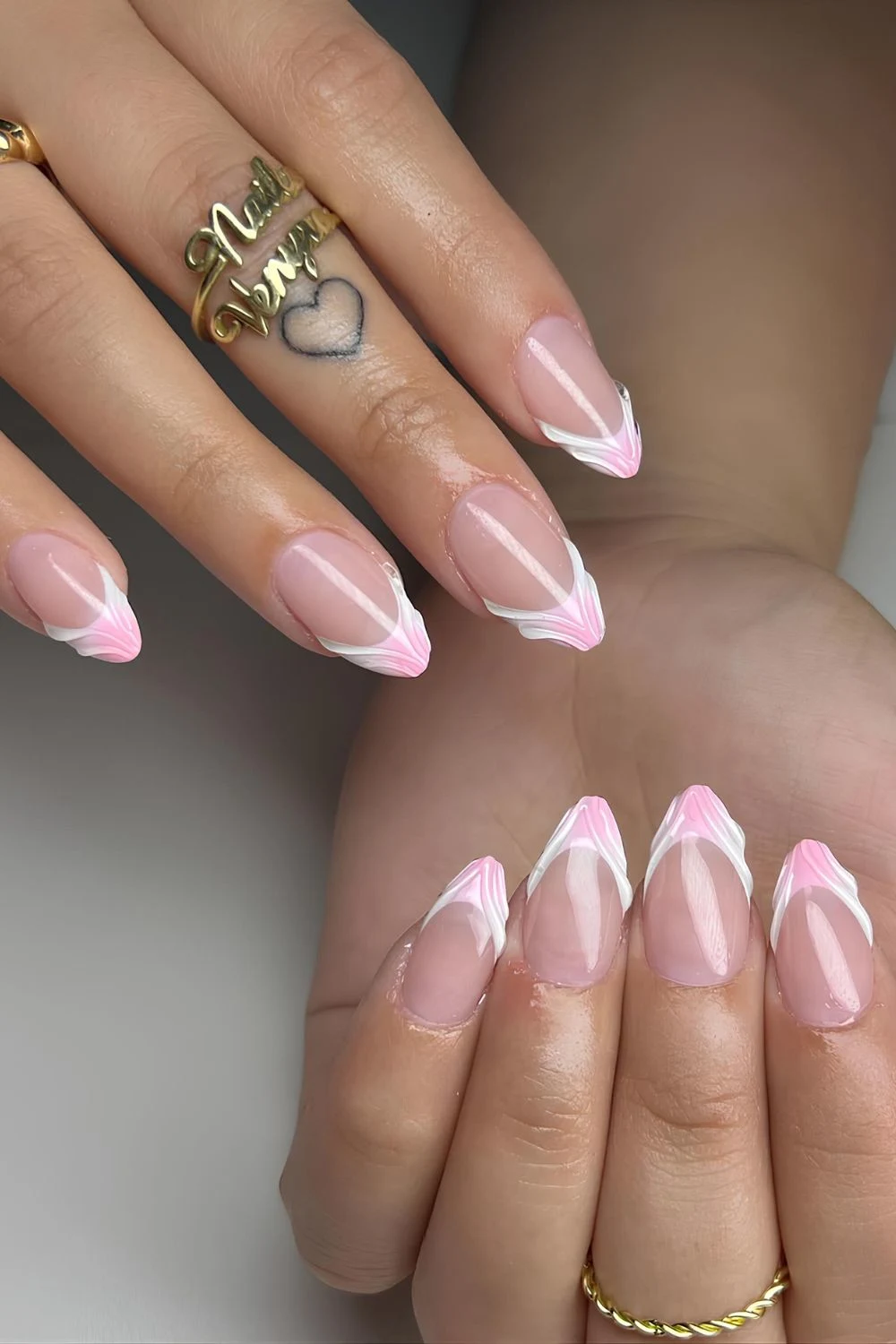 Pink and white textured French tip nails