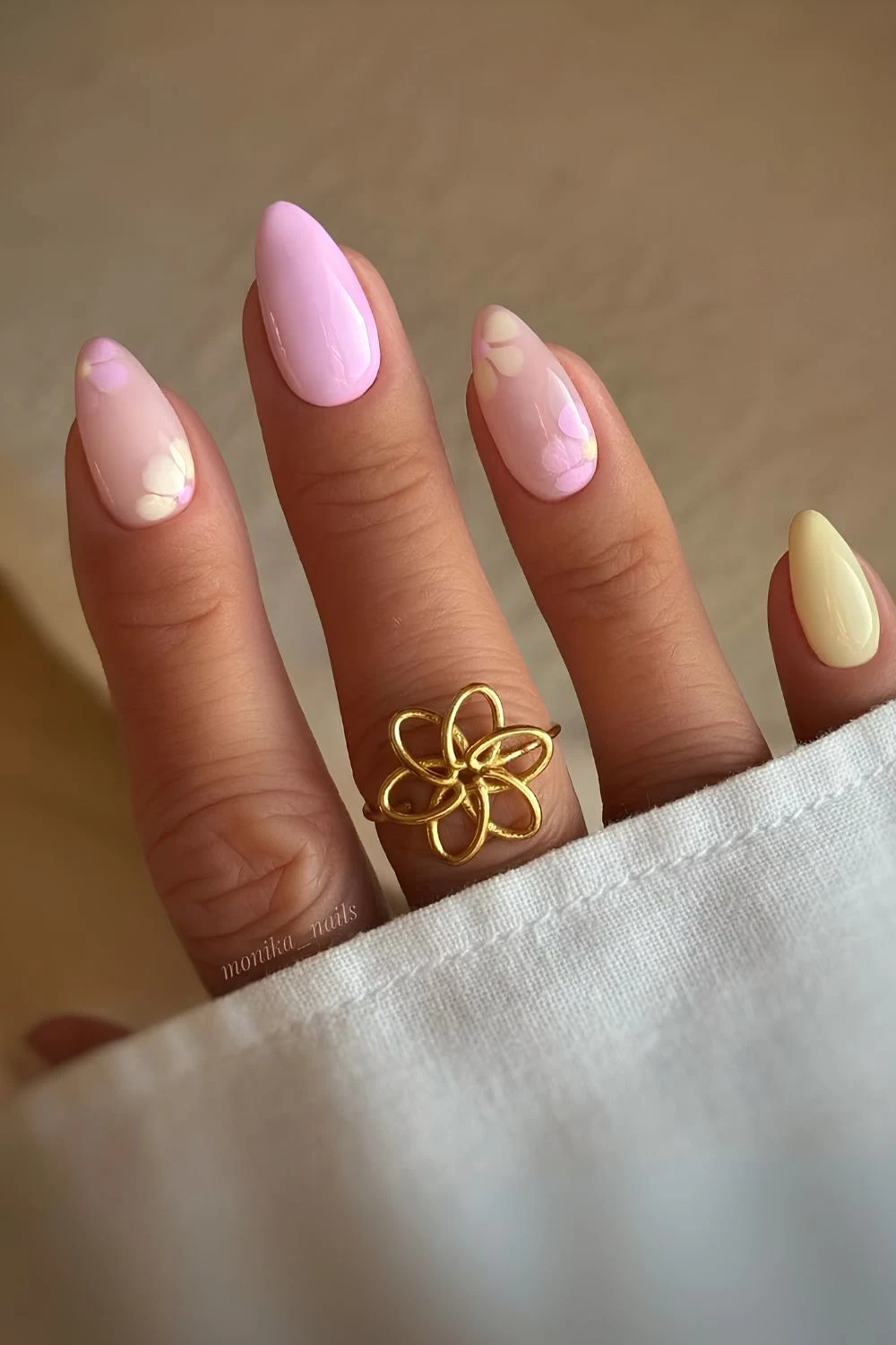 Pink and yellow nails withh blooming gel flowers