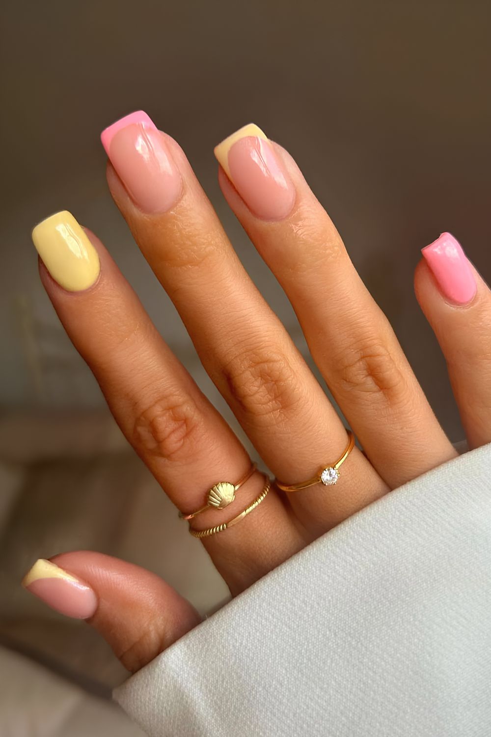 Pink and yellow solid and French combo nails
