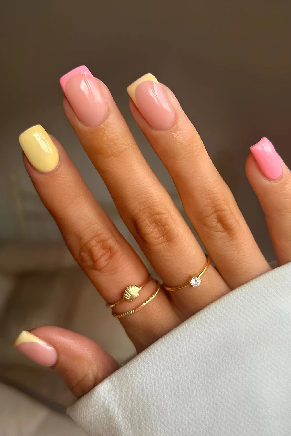 Pink and yellow solid and French combo nails