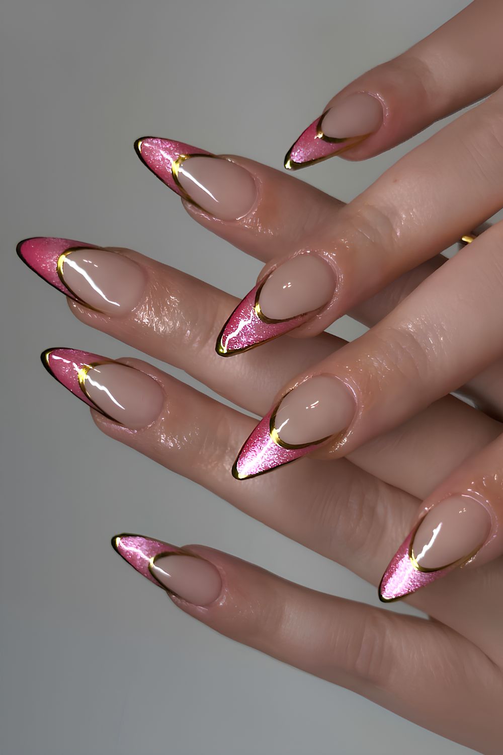 Pink cat eye French mani with gold outlines