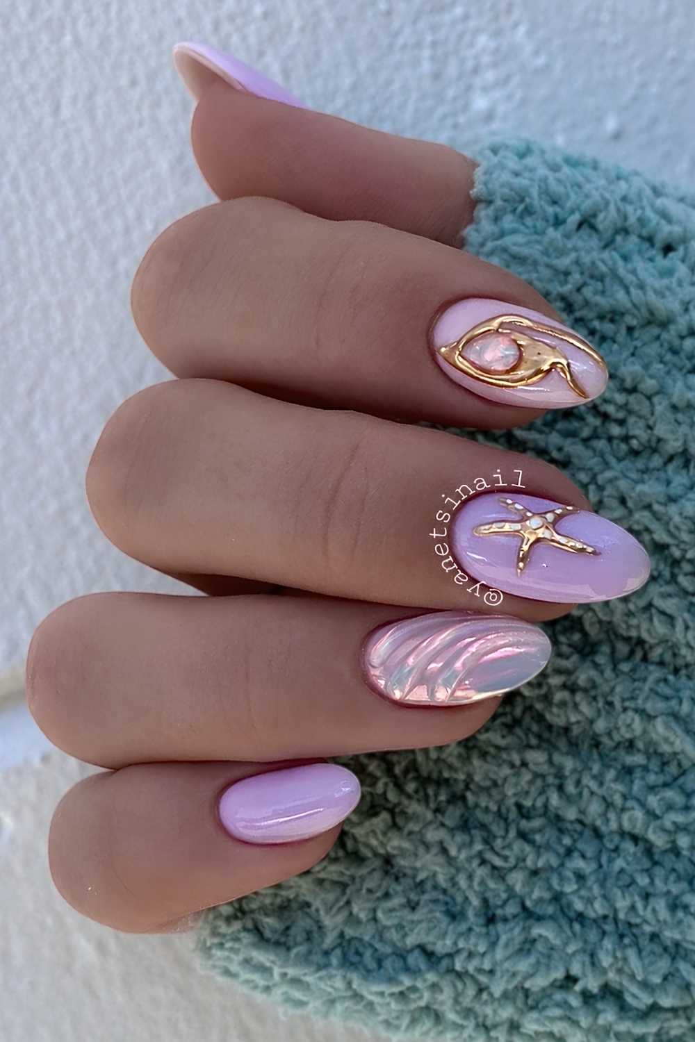 Purple mani with starfish art and gold accents