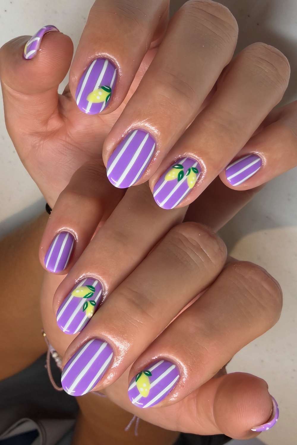Purple striped nails with lemon