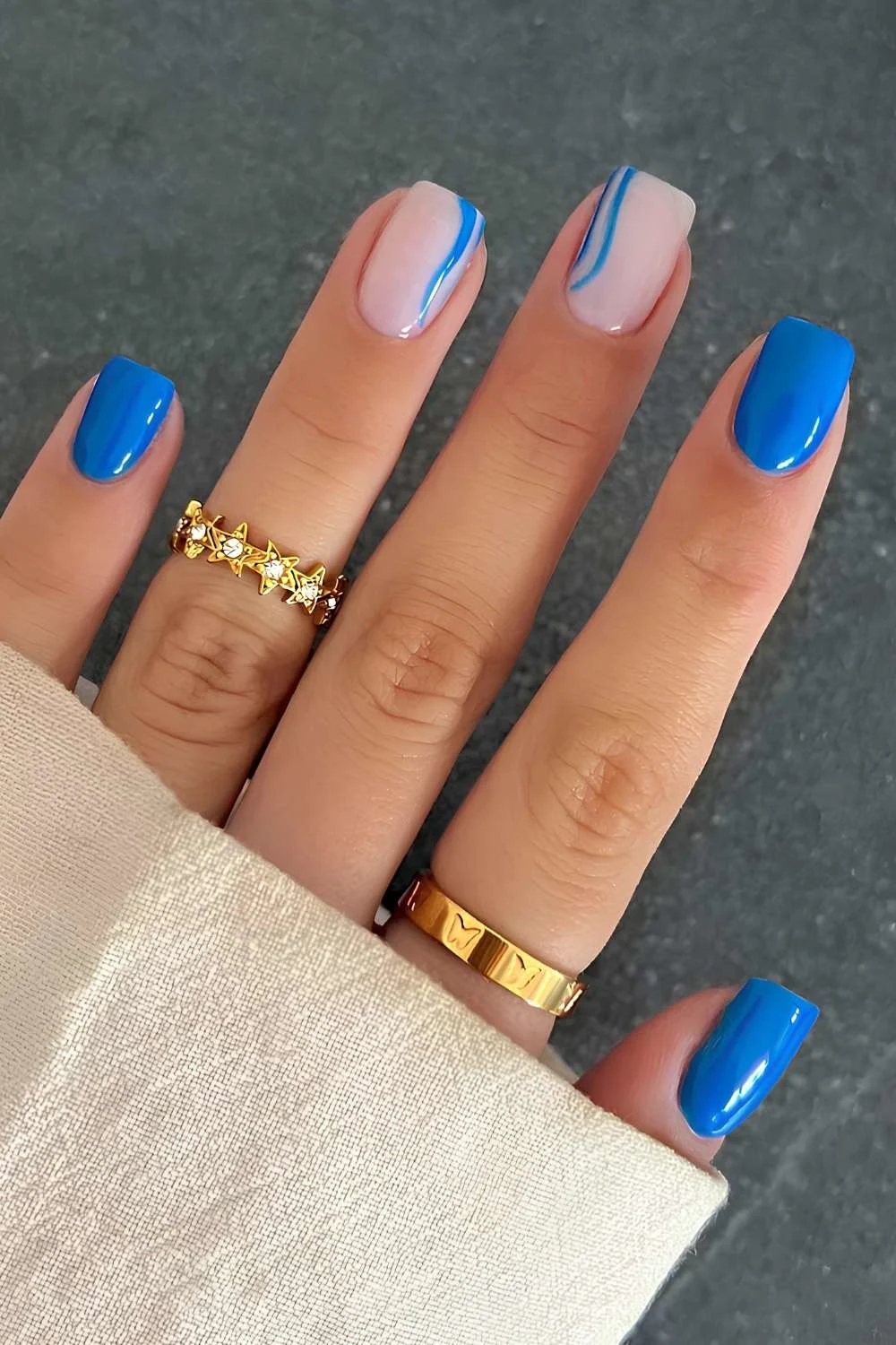 Royal blue nails with accent line art