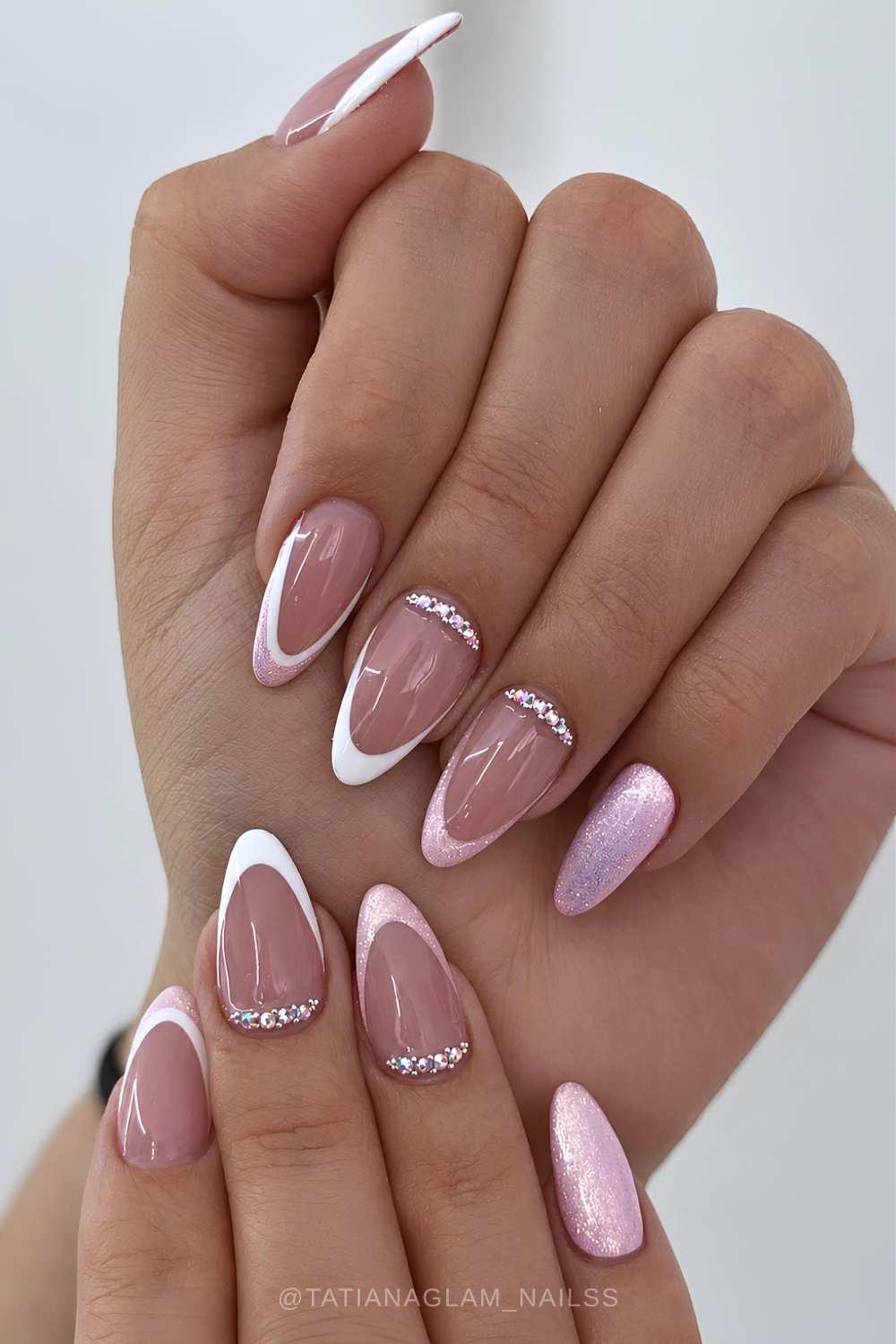 Shimmery pink and white nails with cuticle gems