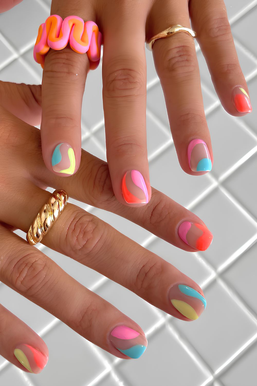 Short colorful nails with negative space accents