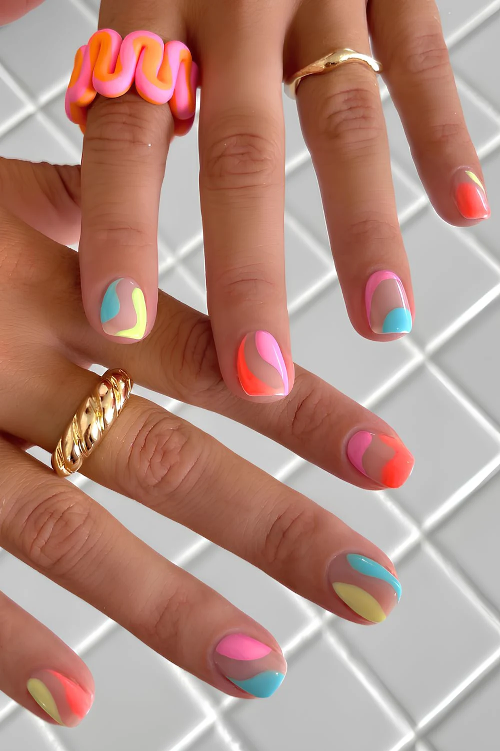 Short colorful nails with negative space accents