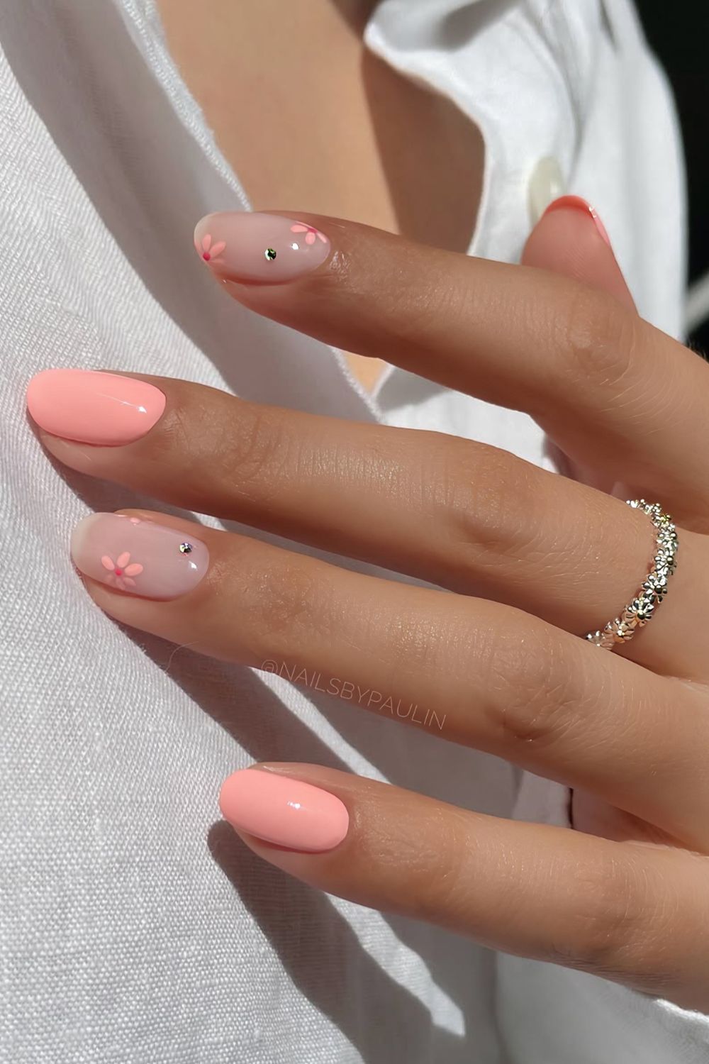Short pink nails with flowers and gems