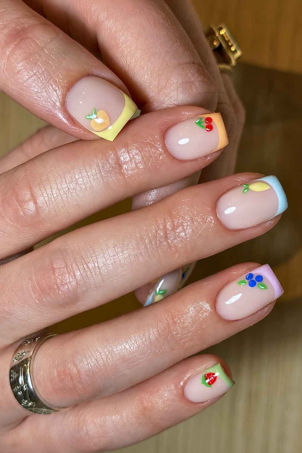 Short skittle French mani with fruit art