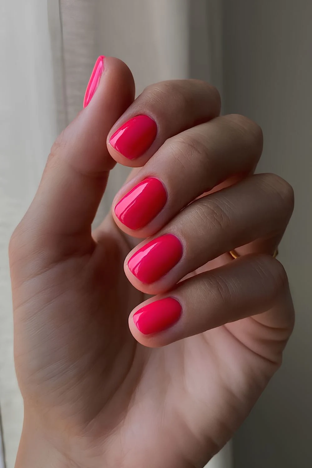 Short solid neon pink nails