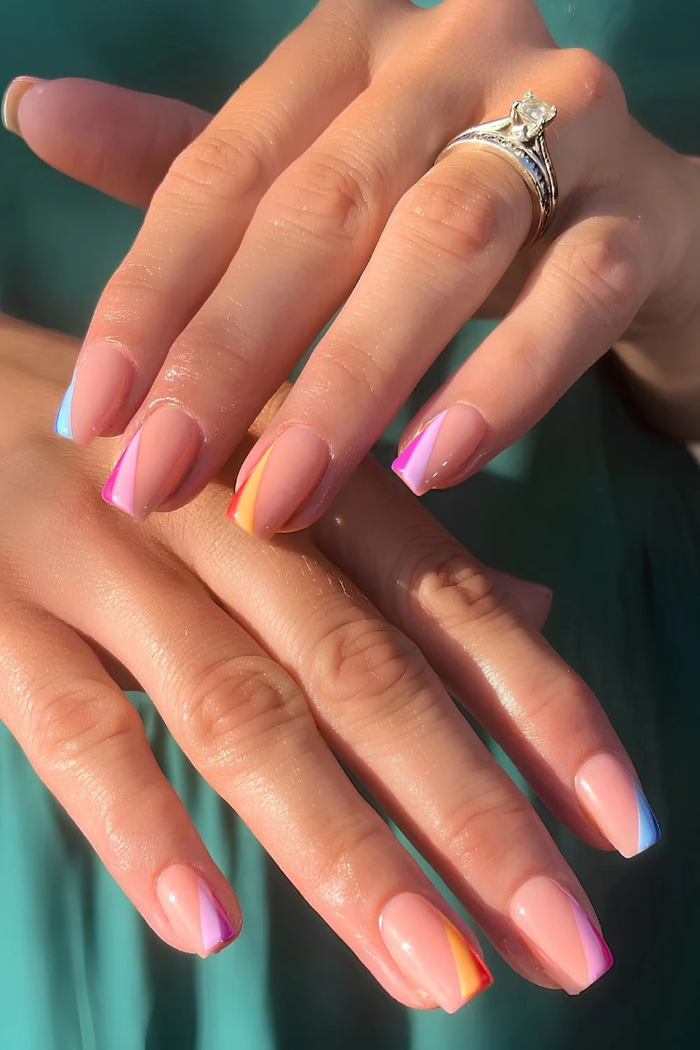 Side French tip mani with colorful stripes