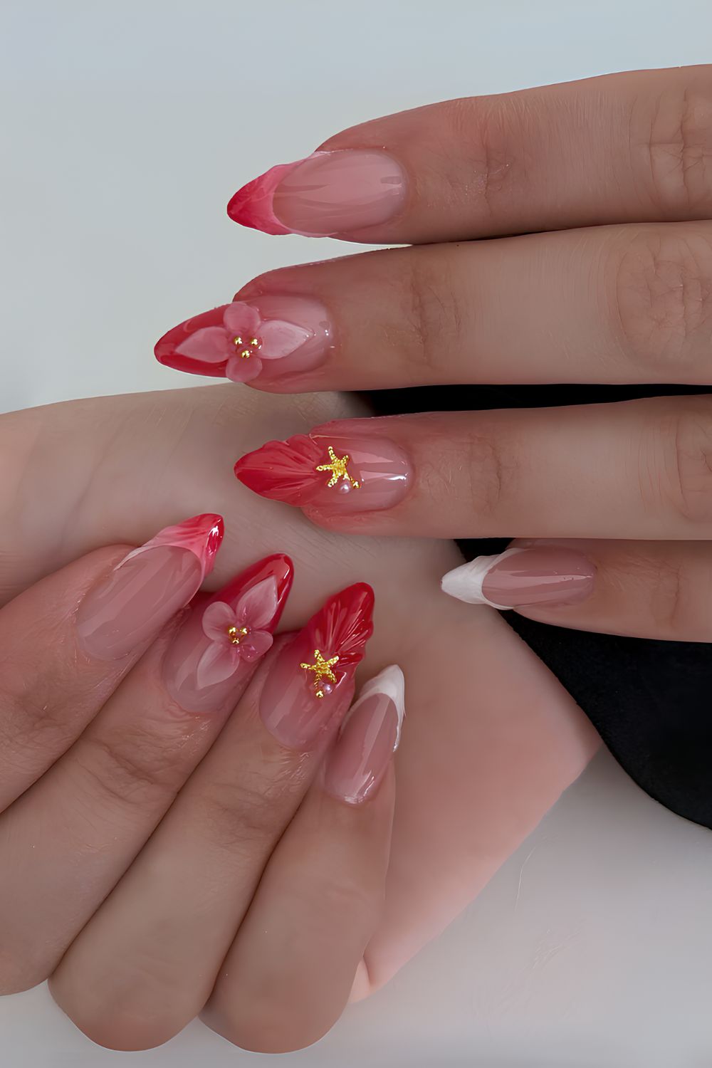Textured red and white French tips with gold starfish accents