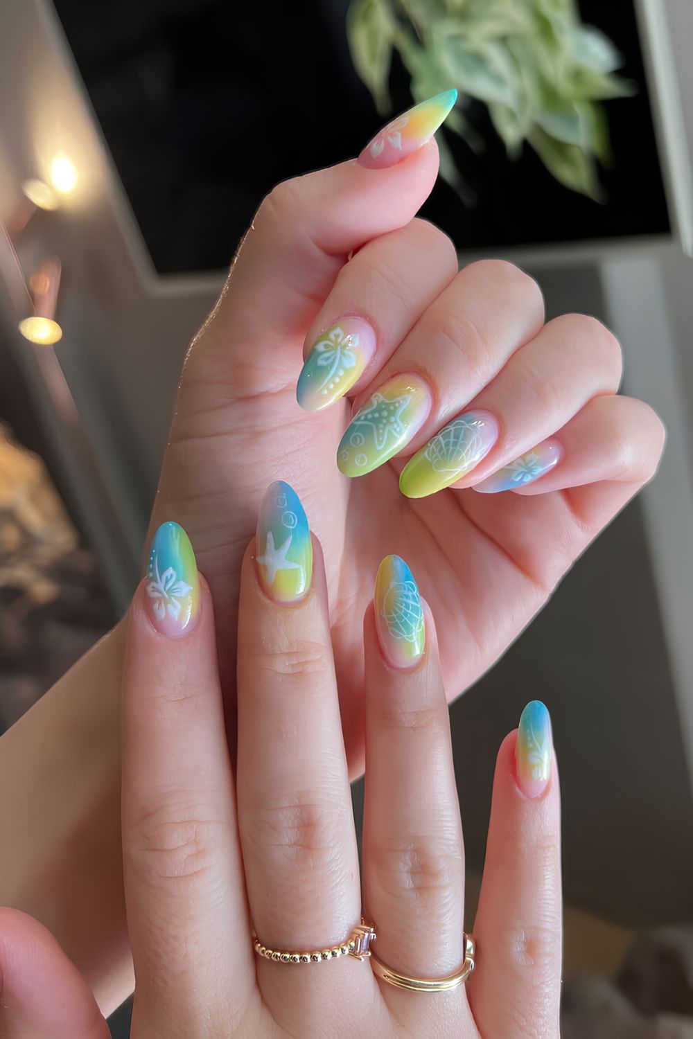 Tropical ombré blend nails in blue, green, and yellow with beach motives