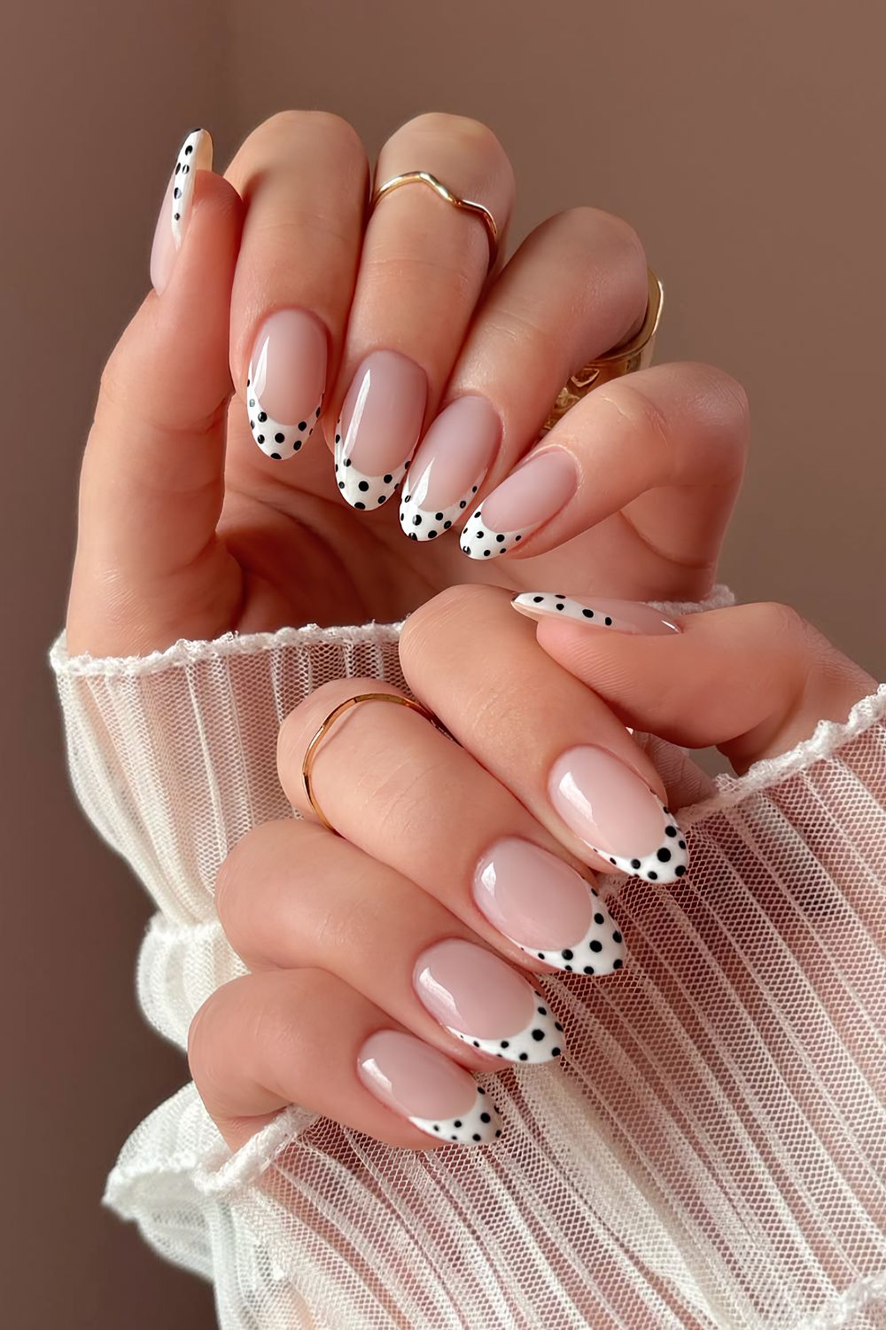 White French mani with black polka dots