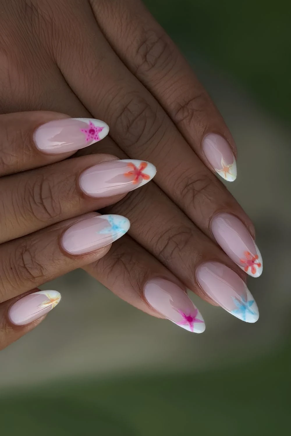 White French tips with colorful starfish design