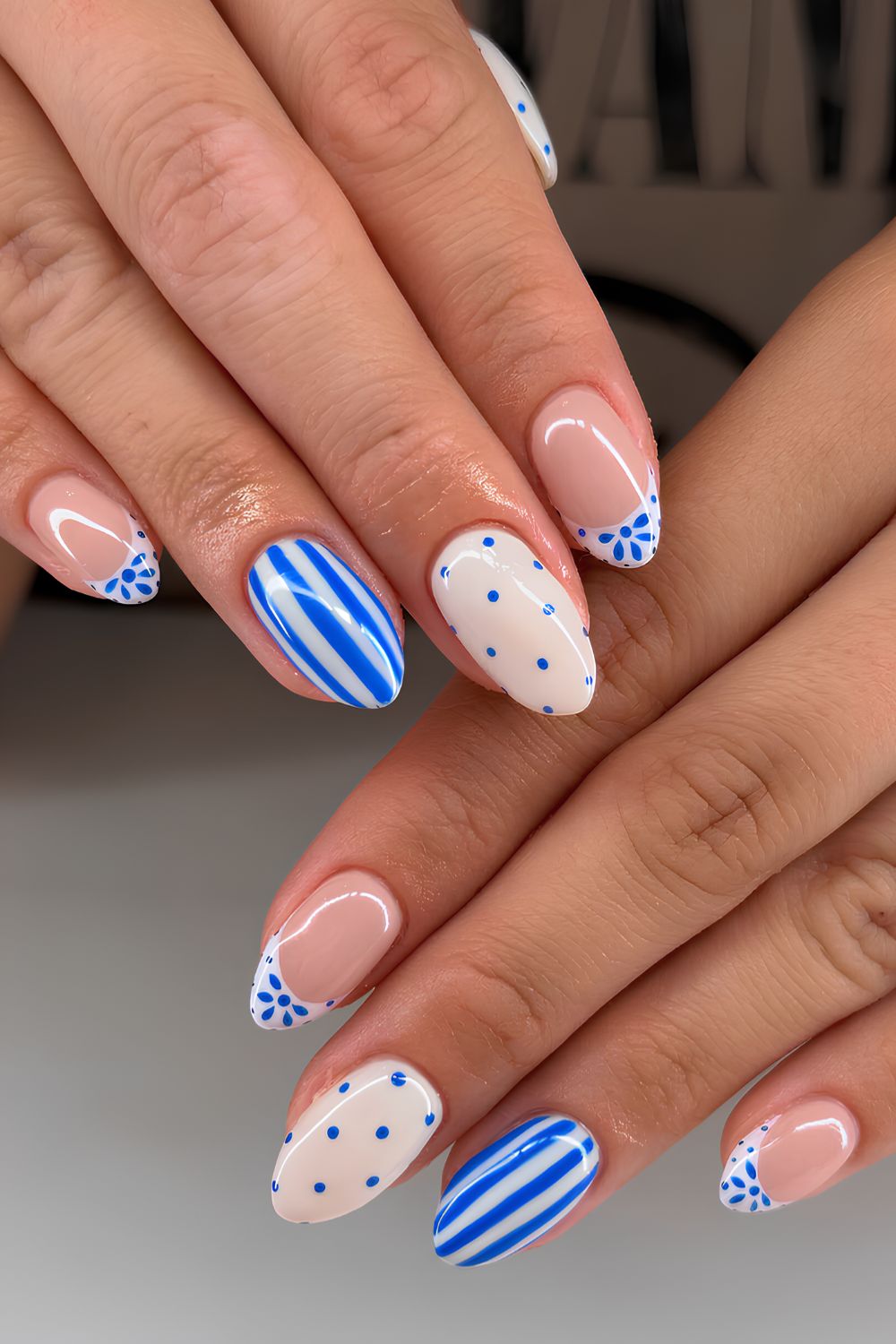White and blue mani with stripes and polka dots