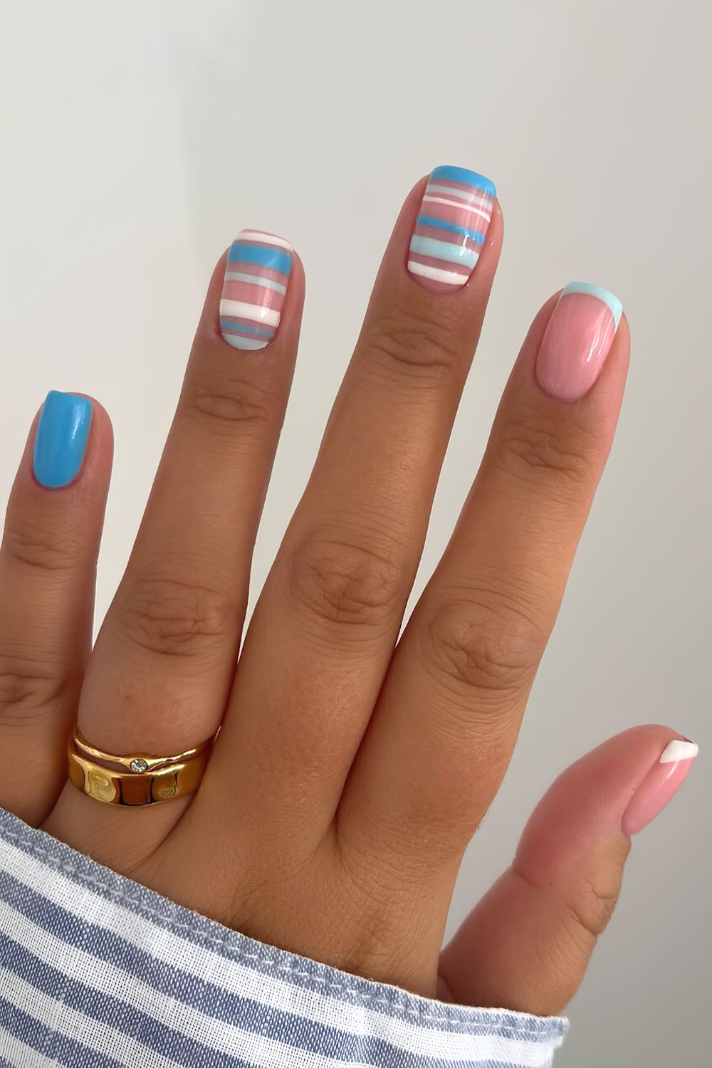 White and blue nails with accent stripe art