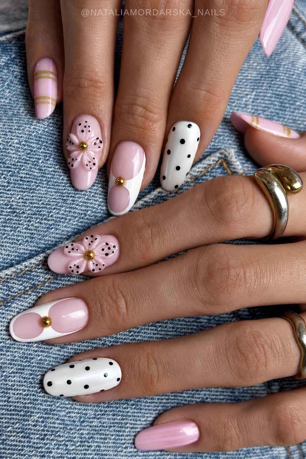 White and pink nails with flowers and black dots