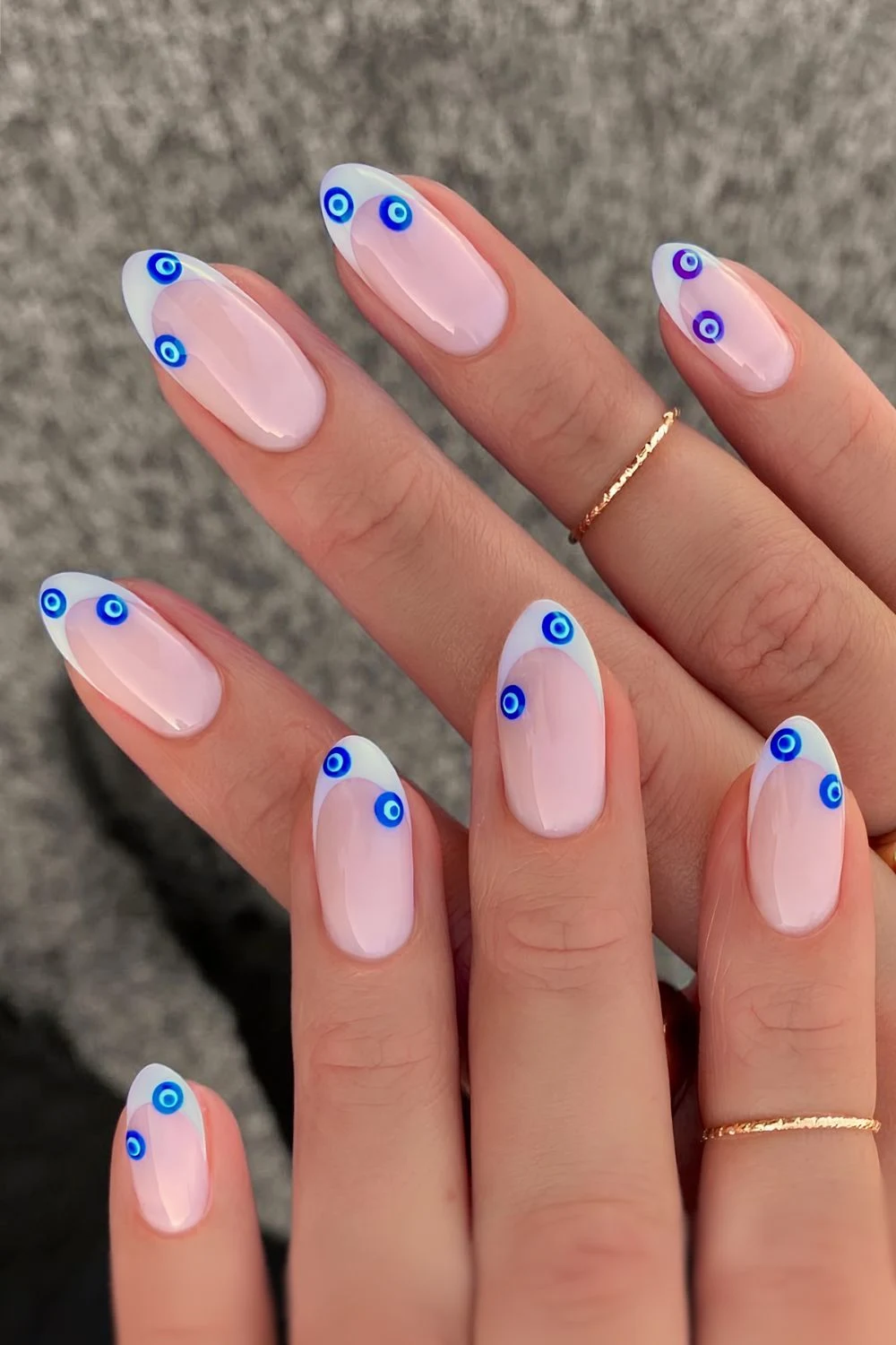 White french tips with evil eye decals