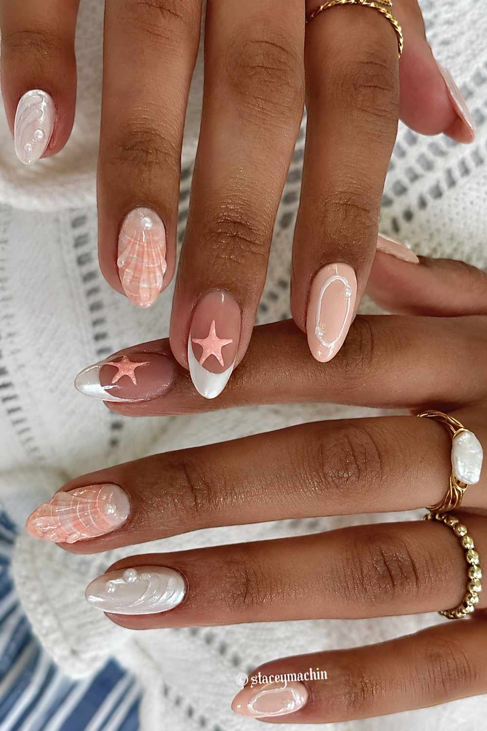 White mani with orange starfish and seashell art