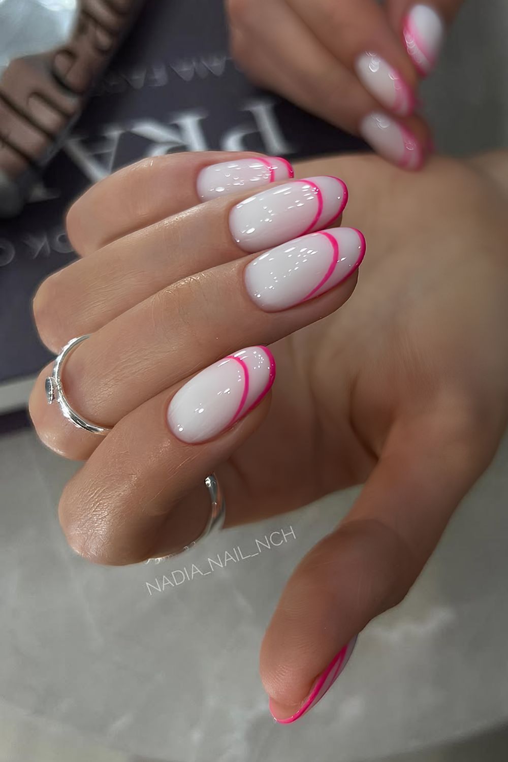 White nails with hot pink double French tips