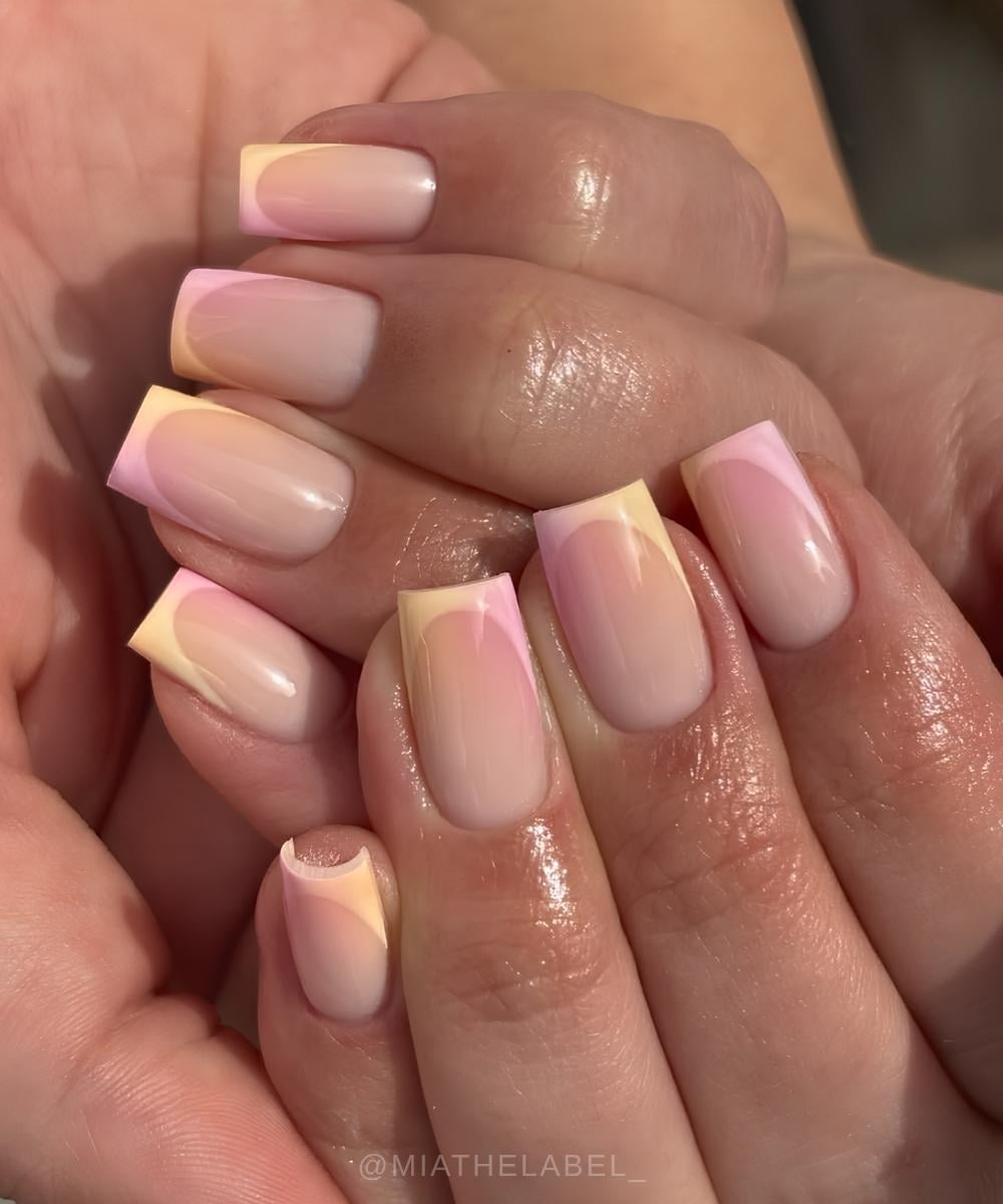 Yellow French nails with pink aura shading