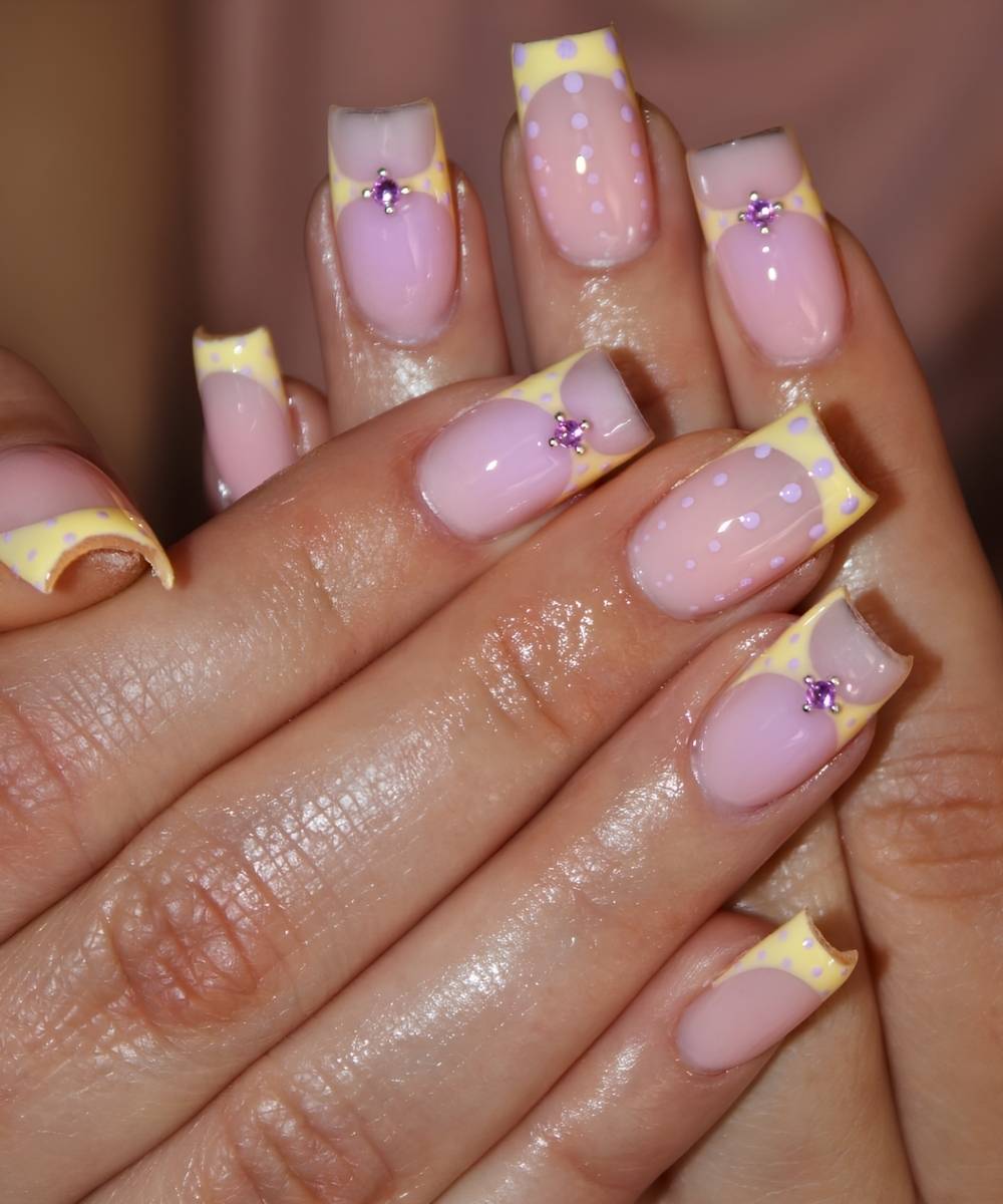 Yellow French nails with purple polka dots