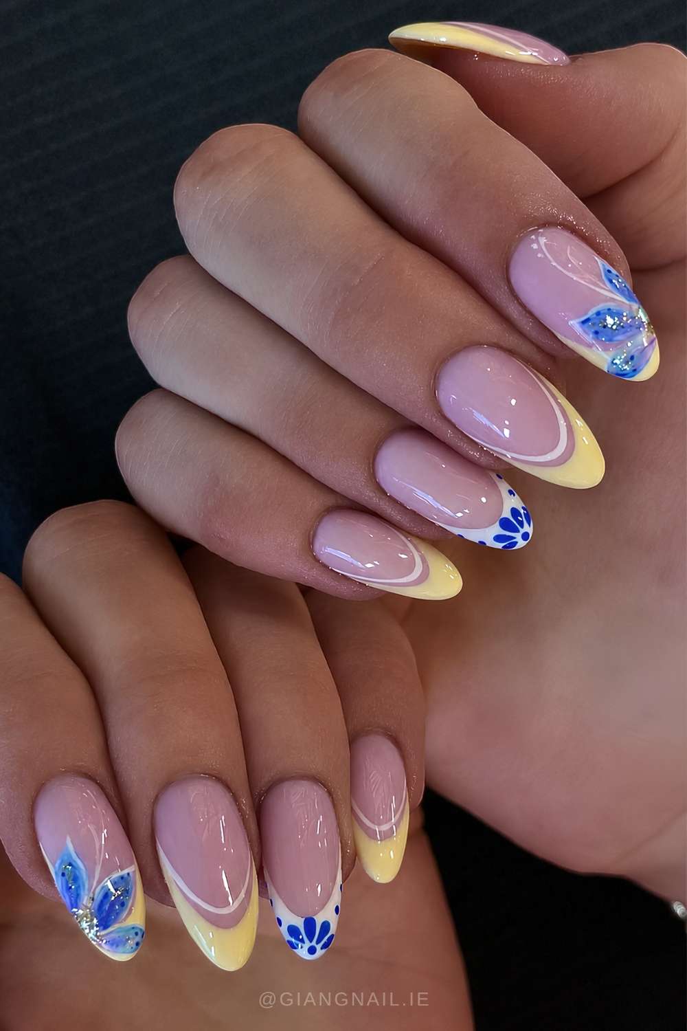 Yellow and white French mani with blue flowers