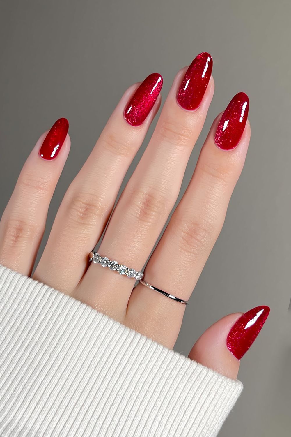 Ruby red nails with a cat-eye effect