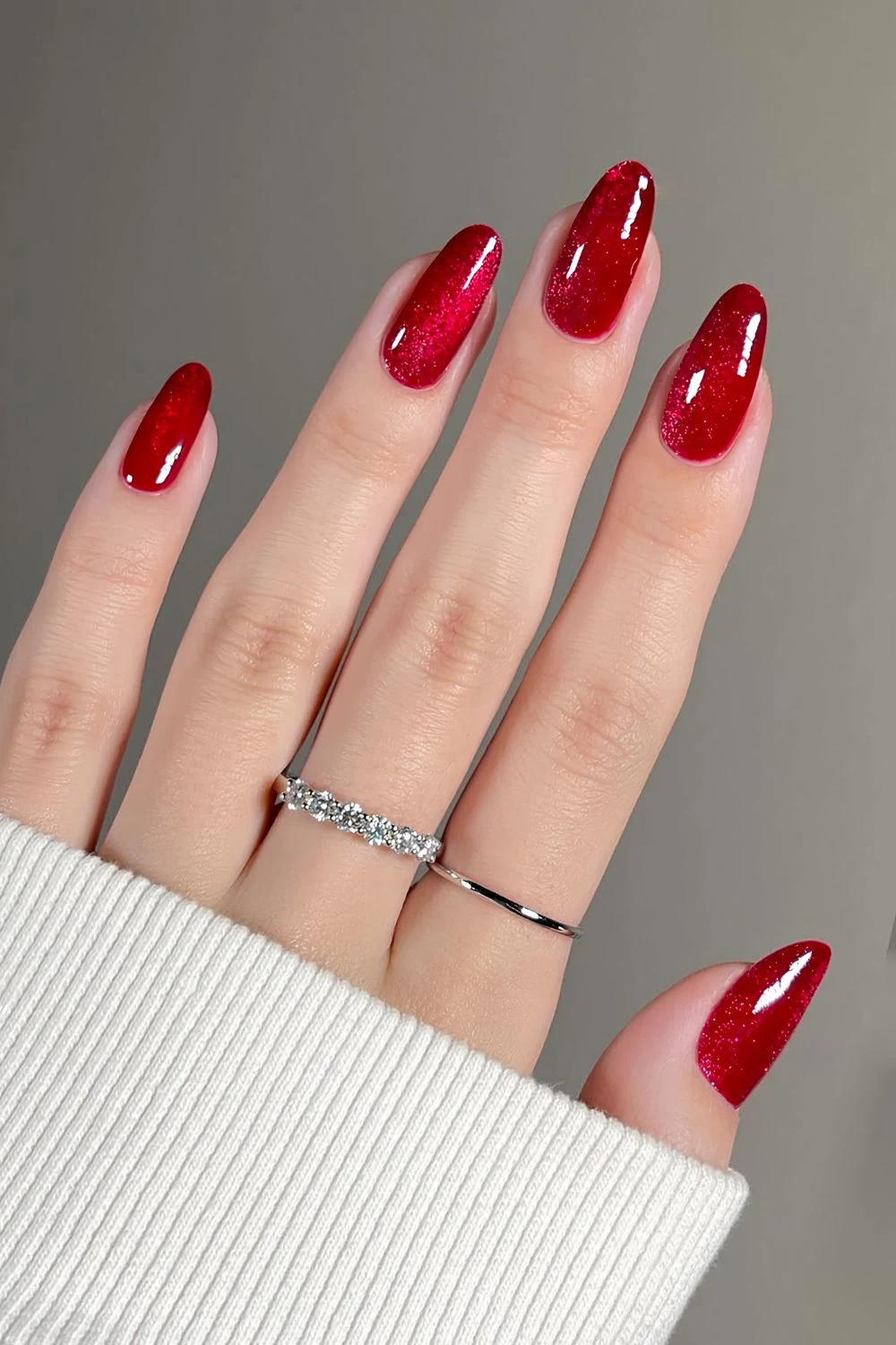 Ruby red nails with a cat-eye effect