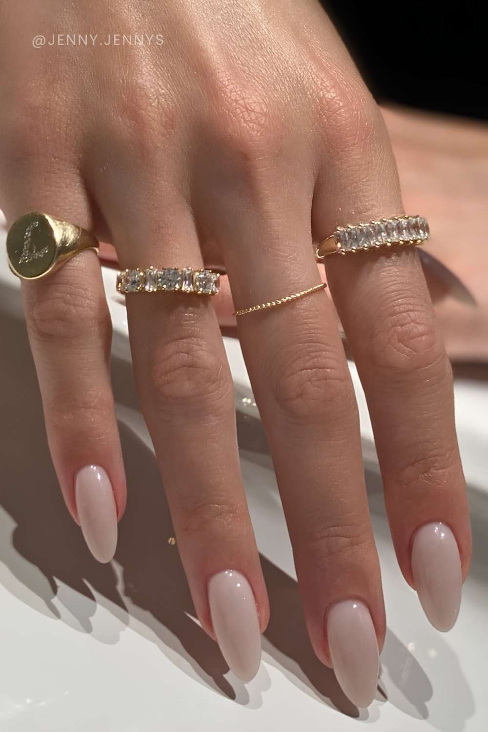 Almond shaped milky white manicure