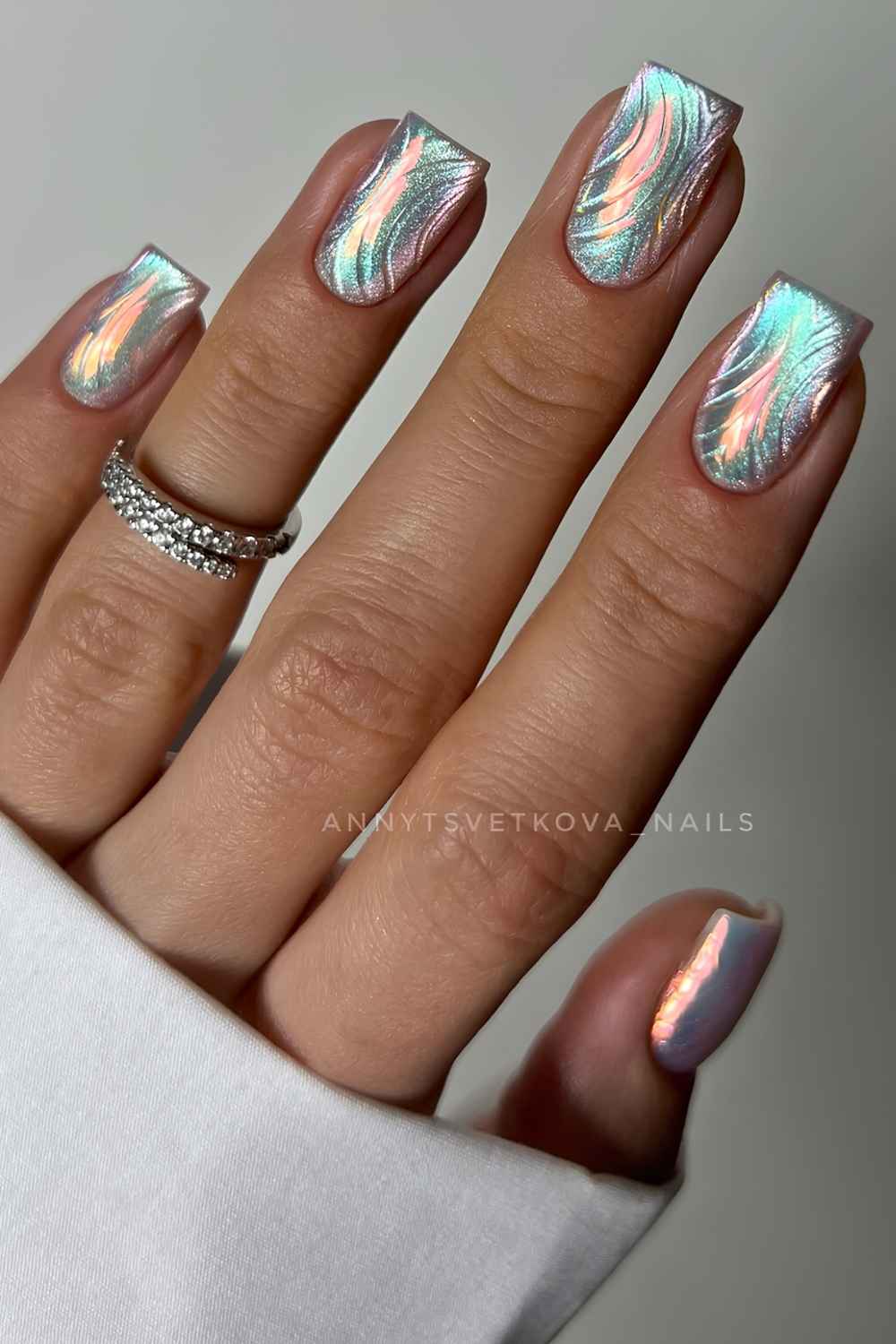 Aurora cat eye nails with accent swirls