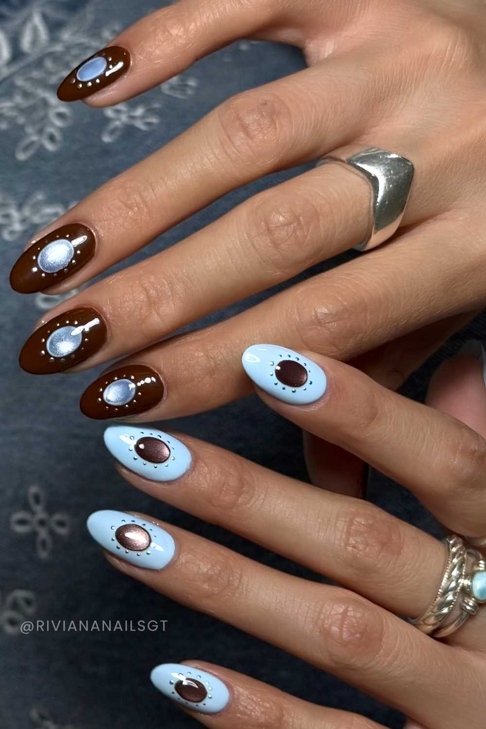 Blue and brown nails with cat eye accents