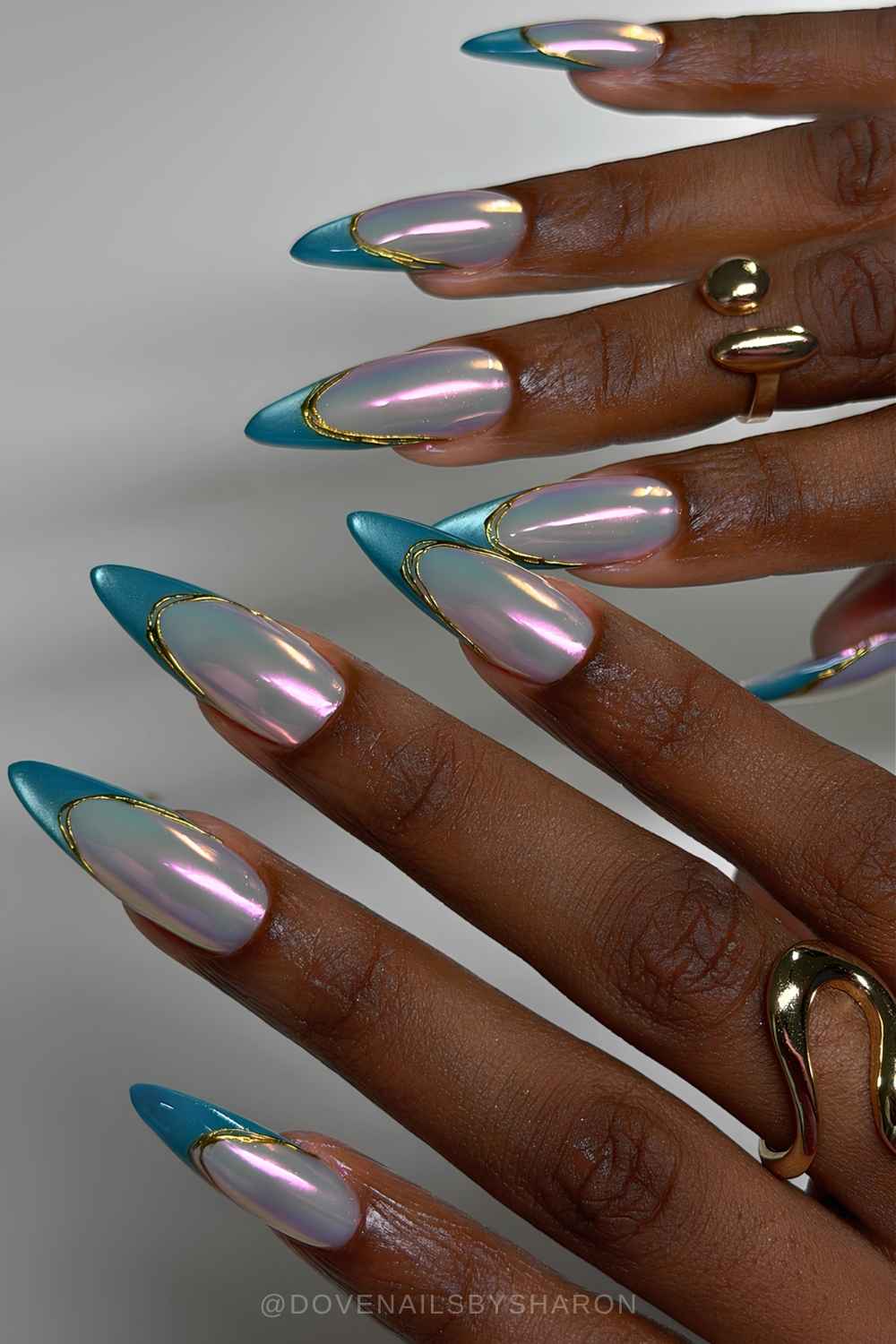 Blue cat eye French mani on aurora chrome base