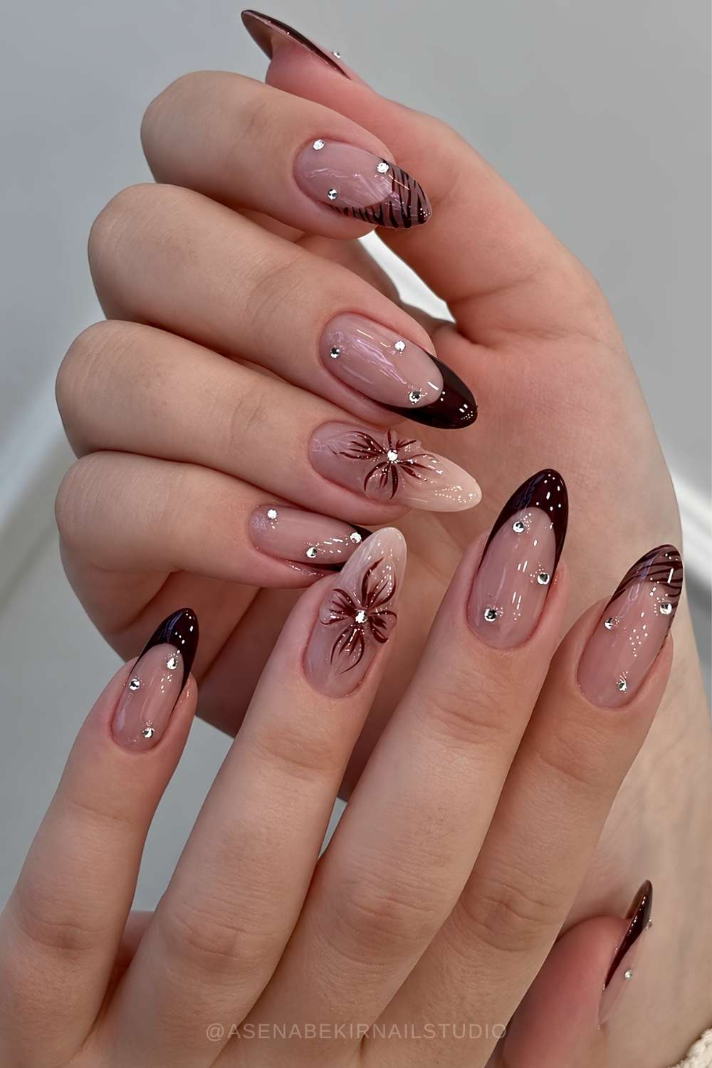 Brown French mani with gems and flowers