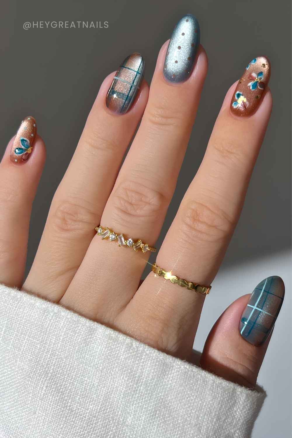 Brown and blue cat eye nails with plaid and flowers