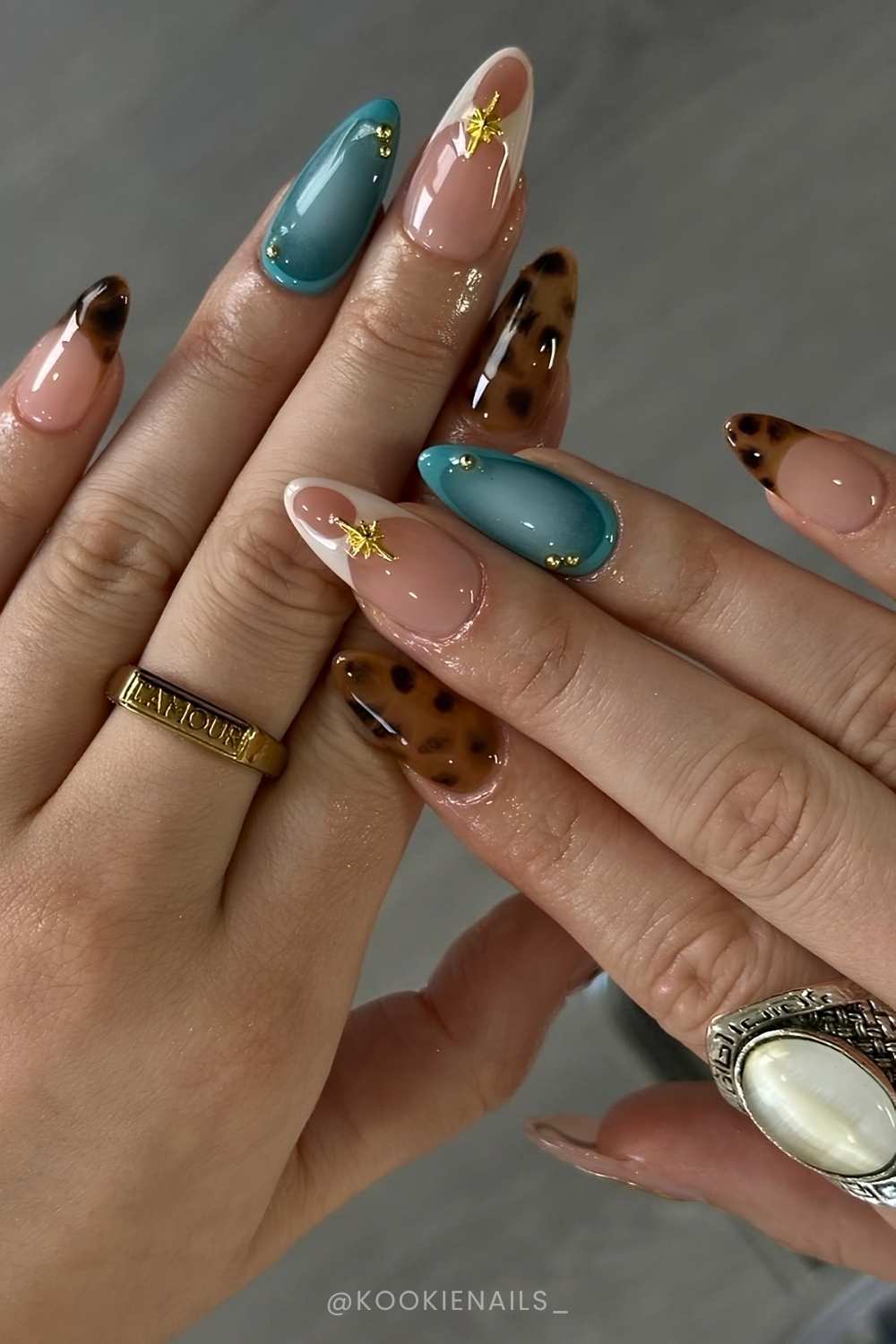 Brown and blue mani with tortie shell and gold accents