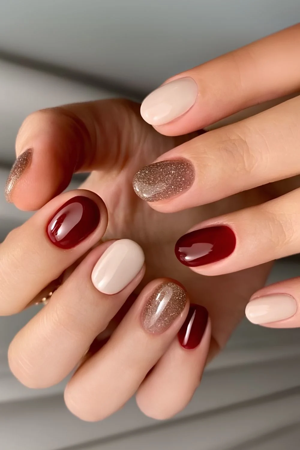 Burgundy and white nails with glitter