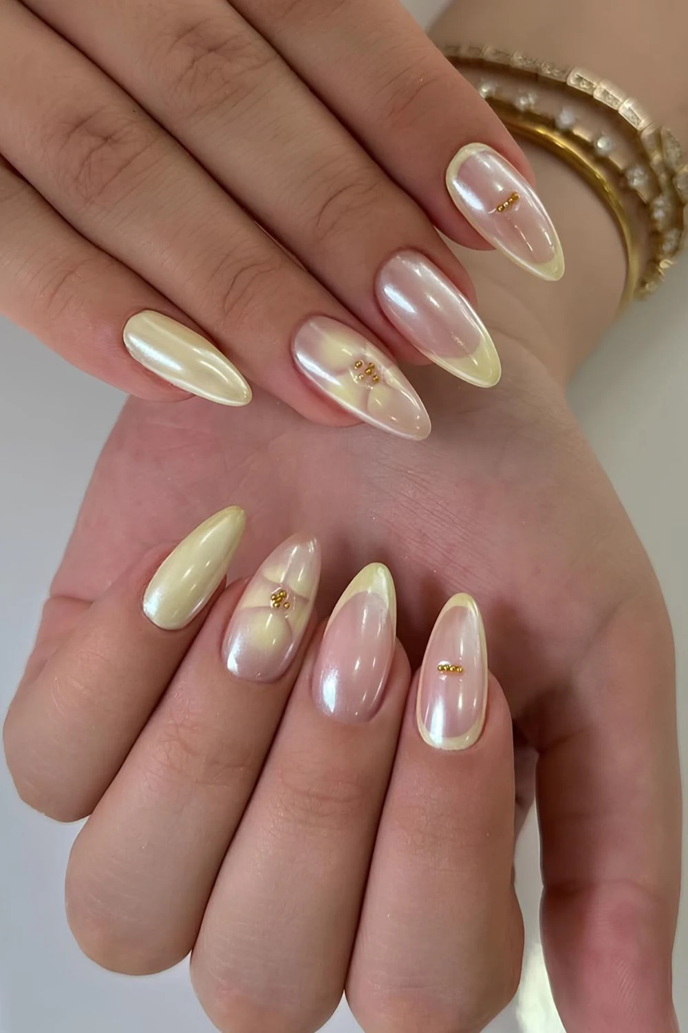 Chrome butter yellow mani with blooming florals